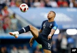France's Kylian Mbappe controls the ball during the semifinal match between France and Belgium at the 2018 soccer World Cup in St. Petersburg, Russia, July 10, 2018.
