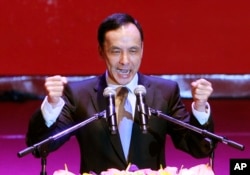 Taiwan's ruling Nationalist Party chairman and presidential candidate in the 2016 elections, Eric Chu, gestures during an extraordinary party congress in Taipei, Taiwan, Saturday, Oct. 17, 2015.