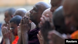 Buddhist monks take part in a prayer ceremony at a buddhist temple for the victims, three days after a string of suicide bomb attacks on churches and luxury hotels across the island on Easter, in Colombo, Sri Lanka, April 24, 2019.