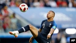 France's Kylian Mbappe controls the ball during the semifinal match between France and Belgium at the 2018 soccer World Cup in St. Petersburg, Russia, July 10, 2018.