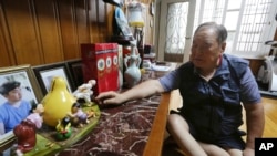 In this Aug. 23, 2018, photo, Ham Sung-chan, 93, watches gifts he received from his North Koran brother Ham Dong Chan during an interview at his house in Dongducheon, South Korea. After nearly 70 years of a separation forced by a devastating 1950-53 war that killed and injured millions and cemented the division of the Korean Peninsula into North and South, Ham and his North Korean brother only got a total of 12 hours together. 