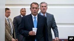 Speaker of the House John Boehner, R-Ohio, with House Majority Whip Kevin McCarthy, R-Calif., right, walks to a meeting of House Republicans at the Capitol on Oct. 15, 2013, as a partial government shutdown enters its third week.