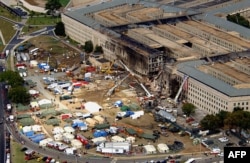 The Pentagon attack site is shown Friday, Sept. 14, 2001, after a plane slammed into the building on Tuesday, Sept. 11. The terrorist attack caused extensive damage to the west face of the building. (AP Photo/Tech. Sgt. Cedric H. Rudisill)