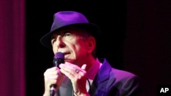 FILE - Leonard Cohen performs at The Fabulous Fox Theatre in Atlanta, March 22, 2013. Cohen, the gravelly-voiced Canadian singer-songwriter died Thursday, November 10, 2016, at age 82.