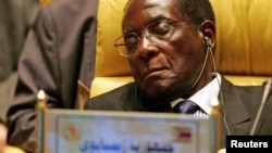 FILE - Zimbabwe's President Robert Gabriel Mugabe closes his eyes during the Africa Union meeting in Sirte, Libya, July 4, 2005. 