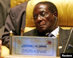 FILE - Zimbabwe's President Robert Gabriel Mugabe closes his eyes during the Africa Union meeting in Sirte, Libya, July 4, 2005.