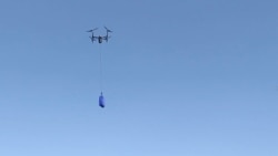 Walmart's drone delivery system is shown during a demonstration of the system. (Walmart)