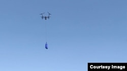 Walmart's drone delivery system is shown during a demonstration of the system. (Walmart)