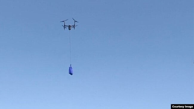 Walmart's drone delivery system is shown during a demonstration of the system. (Walmart)