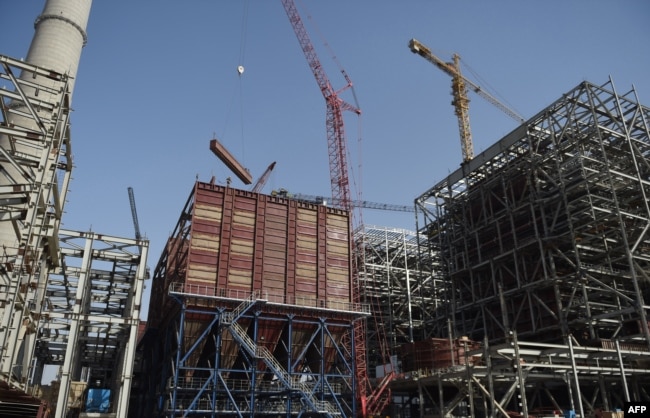 A general view of a Chinese-backed power plant under construction, May 23, 2018, in Islamkot in the desert in the Tharparkar district of Pakistan's southern Sindh province.