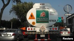 FILE - A tanker truck transporting fuel is pictured along the streets en route to a gas station, in Mexico City, Mexico, Jan. 15, 2019. 