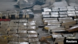 Cocaine packages displayed at Hernan Acosta air base, Tegucigalpa, Honduras, Sept. 4, 2013.