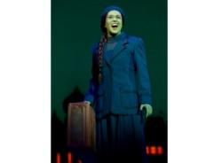 This image released by Polk & Co. shows understudy Carla Stickler in the role of Elphaba from the musical "Wicked" in New York in March 2012. Stickler, who had left show business and became a software engineer in Chicago, returned to New York to star as the green-skinned Elphaba when the cast was ravaged by illness. (Joan Marcus/Polk & Co. via AP)