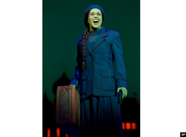 This image released by Polk & Co. shows understudy Carla Stickler in the role of Elphaba from the musical "Wicked" in New York in March 2012. Stickler, who had left show business and became a software engineer in Chicago, returned to New York to star as the green-skinned Elphaba when the cast was ravaged by illness. (Joan Marcus/Polk & Co. via AP)