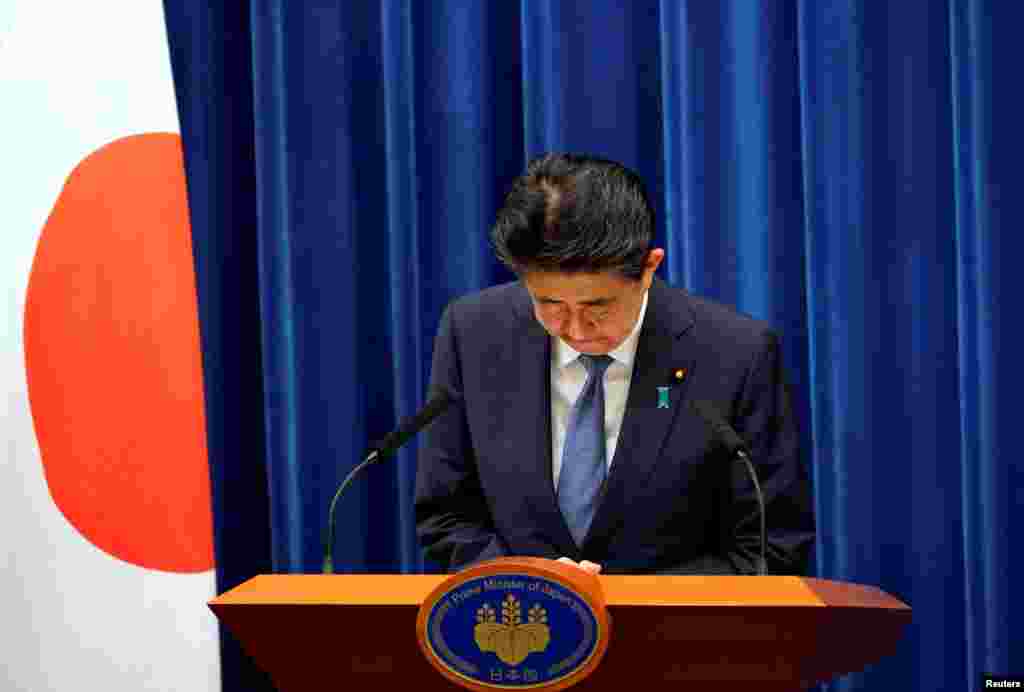 Japanese Prime Minister Shinzo Abe bows during a news conference, where he announced he will resign over health problems, at the prime minister's official residence in Tokyo, Japan.
