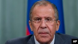 Russian Foreign Minister Sergey Lavrov speaks during a news conference after his meeting with French counterpart Laurent Fabius, unseen, in Moscow, Russia, Sept. 17, 2013. 