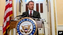 FILE - Sen. Rand Paul, R-Ky., answers reporters' questions during a news conference on Capitol Hill in Washington. 