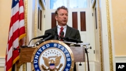 FILE - Sen. Rand Paul, R-Ky., answers reporters' questions during a news conference on Capitol Hill in Washington. 