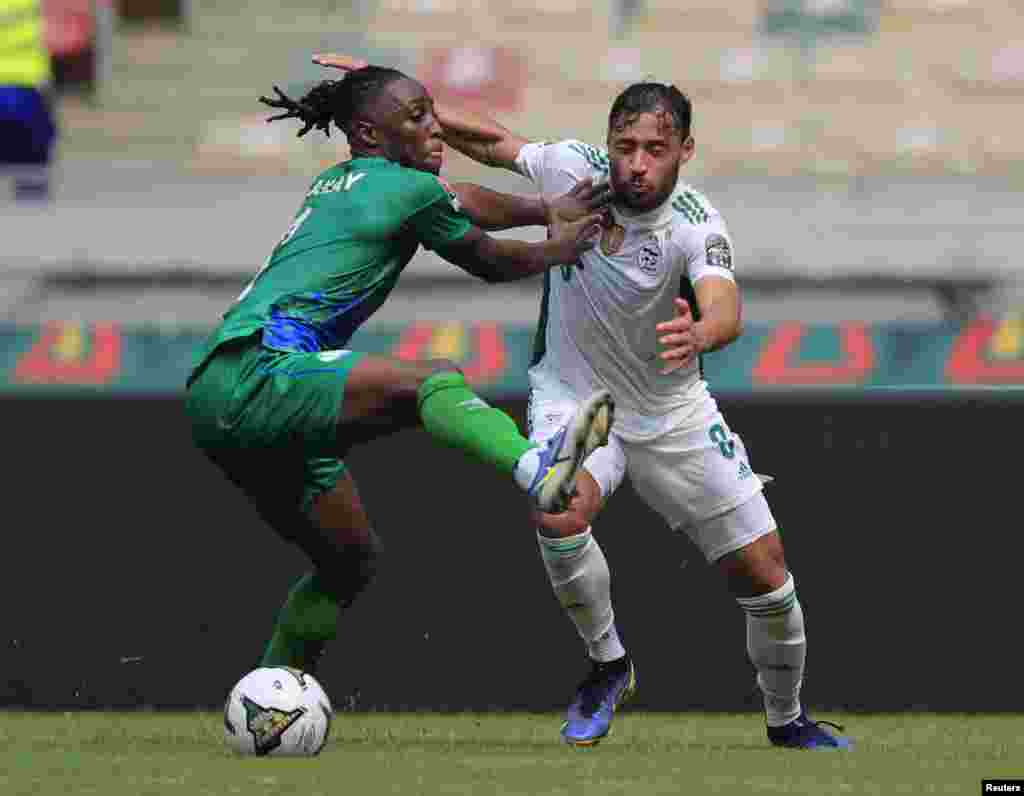 Sierra Leone&#39;s Osman Kakay competes with Algeria&#39;s Youcef Belaili.