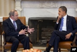 FILE - President Barack Obama meets with Sudan Special Envoy Ambassador Princeton Lyman in the Oval Office, April 1, 2011.