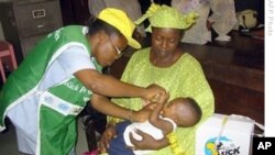 A boy in Nigeria takes vaccine.