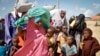 FILE - Somalis flee from drought in the Lower and Middle Shabelle regions of the country as they reach a makeshift camp for displaced persons in the Daynile neighborhood on the outskirts of the capital Mogadishu, May 18, 2019. 
