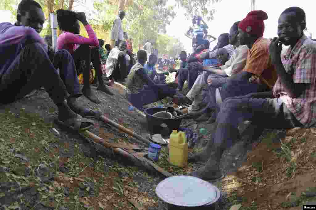 Civilians rest inside the United Nations compound on the outskirts of Juba, South Sudan, Dec. 17, 2013. 