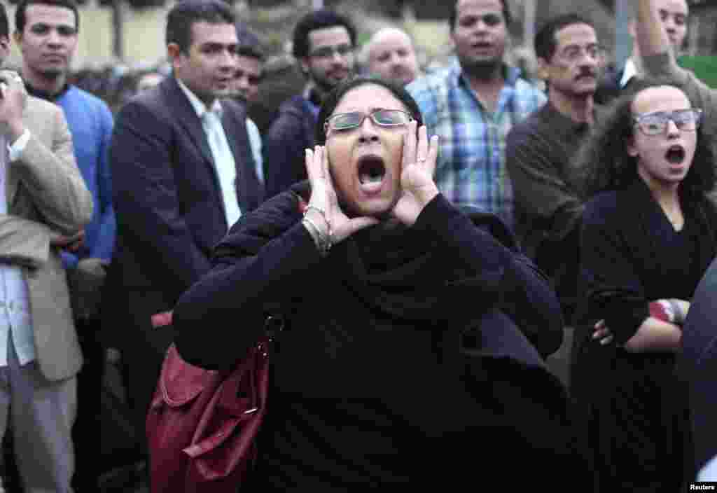 A protester chants anti-Morsi slogans in front of the presidential palace in Cairo December 4.