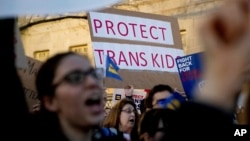 Activists and protesters with the National Center for Transgender Equality rally in front of the White House, Feb. 22, 2017.
