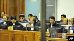 "Brother Number Two" Nuon Chea (4th L) and former Khmer Rouge foreign minister Ieng Sary (2nd R) sit at the Extraordinary Chambers in the Courts of Cambodia (ECCC) on the outskirts of Phnom Penh June 29, 2011. The four most senior surviving members of Cam