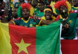 FILE - Cameroon's supporters chant ahead of the African Cup of Nations Group A soccer match between Cameroon and Gabon at the Stade de l'Amitie, in Libreville, Gabon, Jan. 22, 2017.
