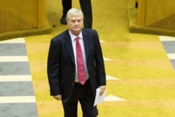 Leader of the conservative Afrikaner Freedom Front Pieter Groenewald joins newly elected Members of Parliament as they are sworn in for the 6th Democratic Parliament on May 22, 2019, in Cape Town.