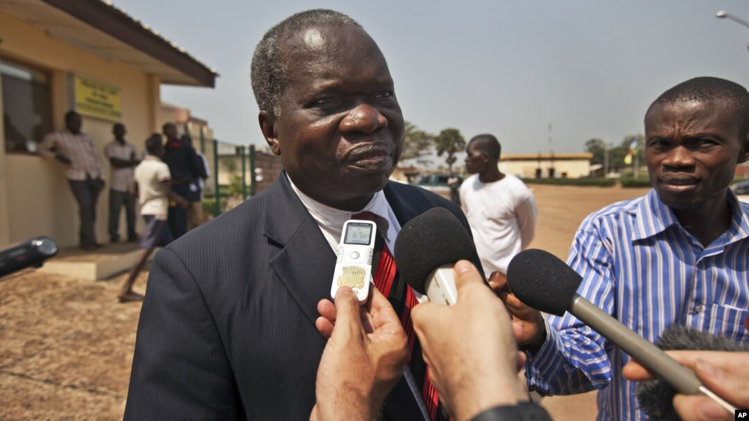 Head of the Central African Republic's government delegation to the peace talks, Jean Willybiro Sako, speaks to the media at the airport in Bangui, Central African Republic Monday, Jan. 7, 2013.