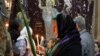 A Christian worshipper takes part in a Palm Sunday ceremony in the Church of the Holy Sepulchre in Jerusalem's Old City, April 9, 2017. 