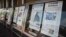FILE - Newspaper front pages are displayed at the Newseum in Washington, July 10, 2017. U.S. lawmakers from both major political parties are supporting legislation that makes it easier for media companies to negotiate deals with internet companies. (AP Photo/Carolyn Kaster)