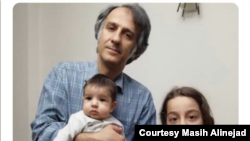 Alireza Alinejad, brother of New York-based VOA Persian TV host Masih Alinejad, with his infant son and daughter prior to his September 2019 arrest by Iranian authorities. (Courtesy Masih Alinejad)