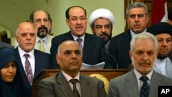 aq's prime minister for the past eight years, Nouri al-Maliki, speaks at a podium surrounded by Iraqi lawmakers, during an address to the nation, announcing that he is stepping down in Baghdad, Iraq, Aug. 14, 2014.