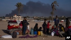 Palestinians who flee from Khan Younis from Israeli ground and air offensive on the Gaza Strip arrive in Rafah, southern Gaza, Jan. 22, 2024.