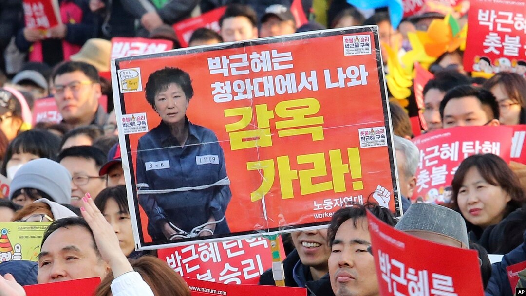 Protesters rally calling for impeached President Park Geun-hye's arrest in Seoul, South Korea, March 11, 2017.