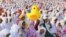 Muslim women attend an Eid al-Fitr prayer marking the end of the holy fasting month of Ramadan at Parangkusumo beach in Yogyakarta, Indonesia, July 17, 2015. 