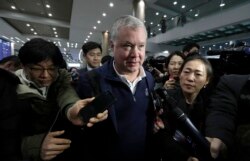 FILE - U.S. Special Representative for North Korea Stephen Biegun, center, is questioned by reporters upon his arrival at Incheon International Airport in Incheon, South Korea, Feb. 3, 2019.