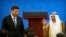 FILE— Kuwait's ruling emir, Sheikh Sabah Al Ahmad Al Sabah, right, waves as he stands with Chinese President Xi Jinping after speaking during the opening session of the 8th Ministerial Meeting of the China-Arab States Cooperation Forum in Beijing, July 10, 2018.