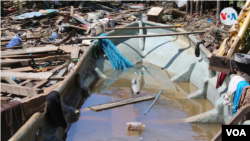 El agua estacancada podría propiciar enfermedades como el dengue o la malaria, afirman los expertos. Foto Houston Castillo, VOA.