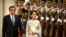 China's Premier Li Keqiang (L) and Myanmar State Counselor and Foreign Minister Aung San Suu Kyi review an honor guard during a welcome ceremony at the Great Hall of the People in Beijing, Aug. 18, 2016.