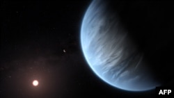A handout artist's impression released Sept. 11, 2019, by ESA/Hubble shows the K2-18b super-Earth, the only super-Earth exoplanet known to host both water and temperatures that could support life.