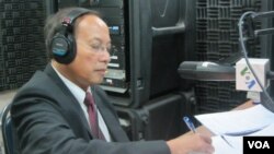 FILE - Government spokesman Phay Siphan sits in the VOA studio in Phnom Penh in 2012.