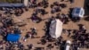 A photo taken by a drone shows displaced Palestinians gathered with their belongings as they wait to return to their homes in the northern part of the Gaza Strip, Jan. 26, 2025, days after a ceasefire deal between Israel and Hamas came into effect.