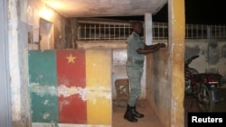 FILE - A security officer stands in guard at a prison in Yaounde,Cameroon, Sept. 1, 2017. Overcrowded prisons in the country are said to have become hotbeds for the coronavirus. 