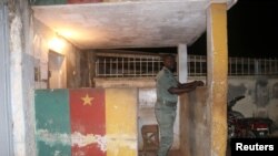 FILE - A security officer stands guard at a prison in Yaounde, Cameroon, Sept. 1, 2017. An inmate last year pretended to be Cameroon's President Paul Biya and conned the Nigerien embassy out of an undisclosed sum of money.