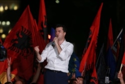FILE - Main opposition Democratic Party leader Lulzim Basha delivers a speech during an anti-government rally in Tirana, Albania, June 21, 2019.